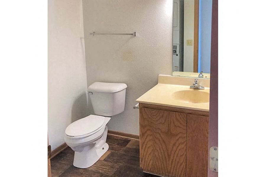 a bathroom with a toilet and a sink