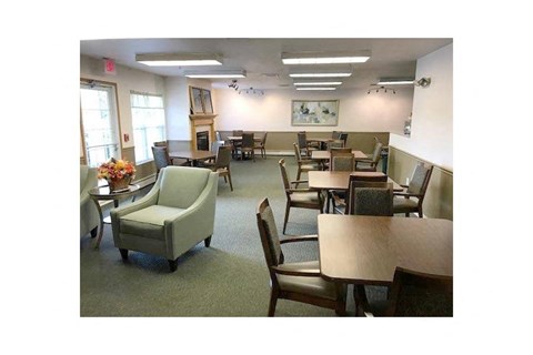 a large room with tables and chairs and chairs