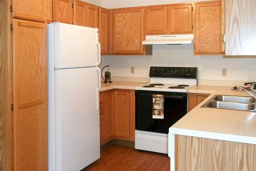a kitchen with a stove and a refrigerator