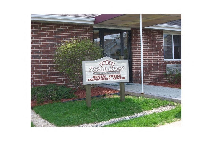 A sign in front of a building that says "Odd Fellows Home & Community Center Rental Office".