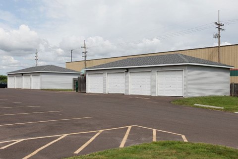 a kitchen with white appliances and wooden cabinets