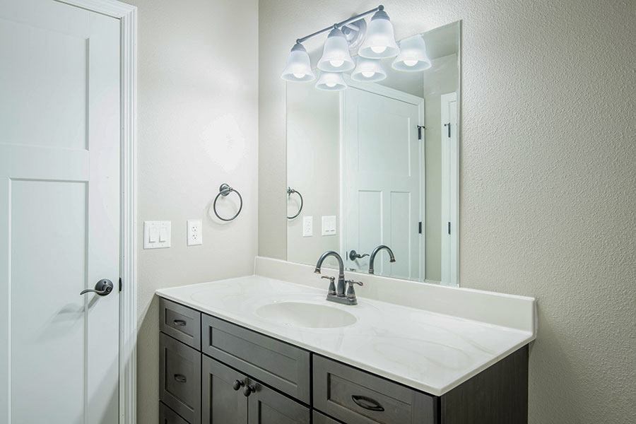 a bathroom with a sink and a mirror