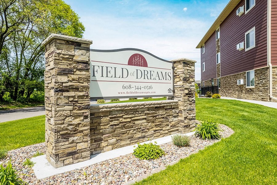 the sign for field dreams in front of a building