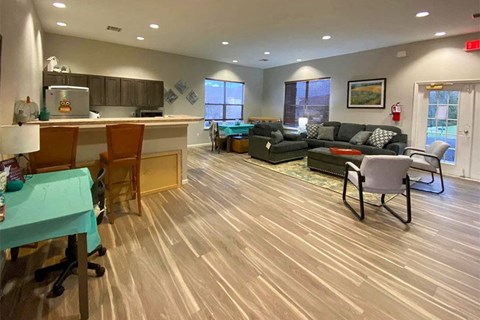 a living room with a kitchen and a couch