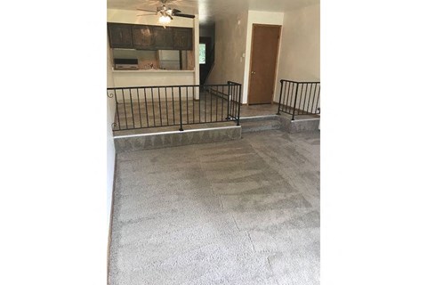 a view of a living room with a staircase