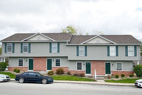 a house with cars parked in front of it