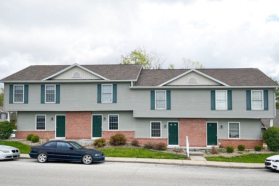 a house with cars parked in front of it