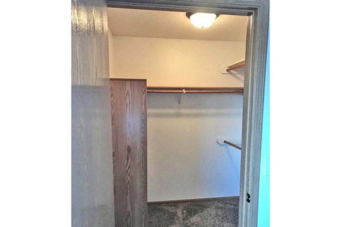 a bathroom with a closet and a light in it