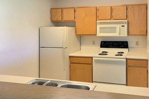 a kitchen with a stove microwave and refrigerator