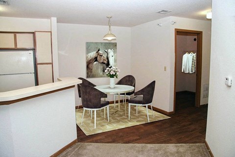 a dining room with a table and chairs