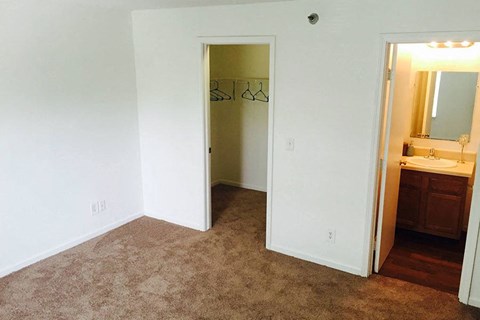 an empty bathroom with a sink and a mirror