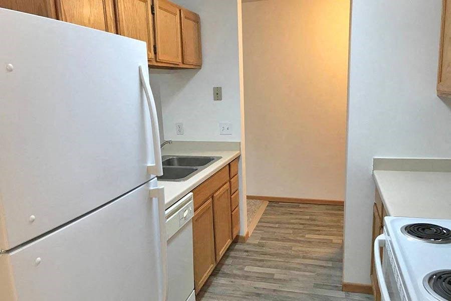a kitchen with a stove and a refrigerator