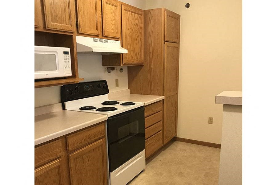 a kitchen with a stove and a microwave