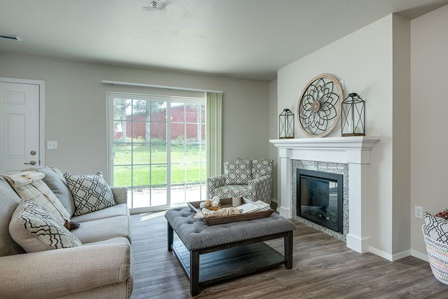 A living room with a fireplace and a couch.