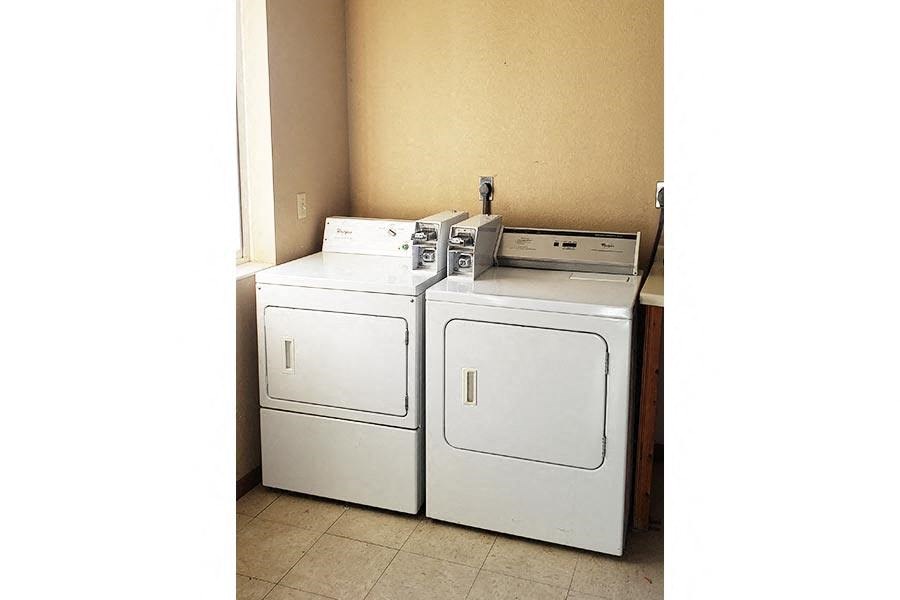 a room with two washing machines in it