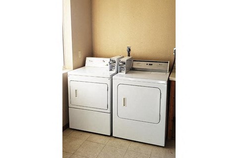 a room with two washing machines in it