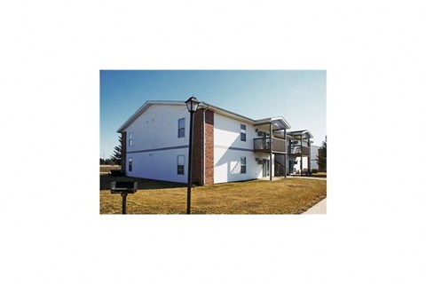 an image of a white house with a balcony
