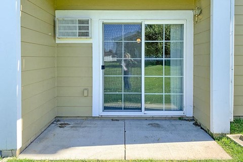a backdoor of a house with a glass door