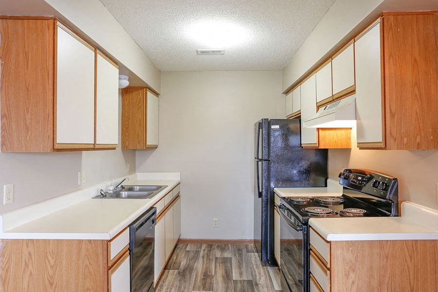 a kitchen with a stove and a refrigerator