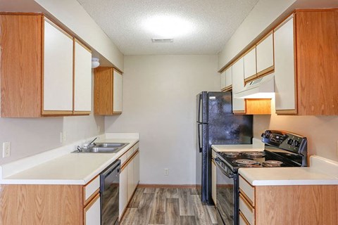 a kitchen with a stove and a refrigerator