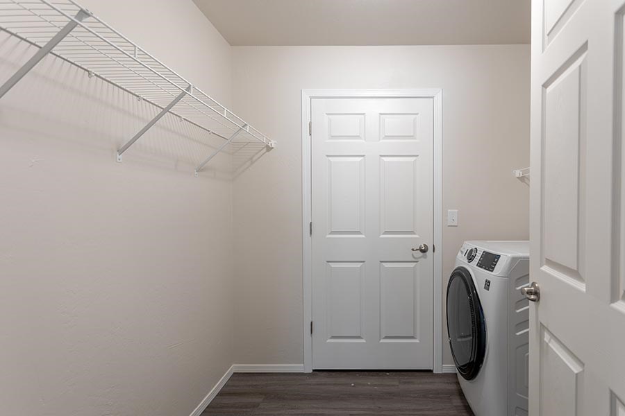 A laundry room with a washer and dryer.