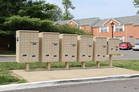 a row of mailboxes on the side of a street