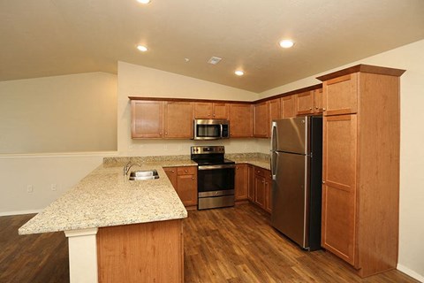 a kitchen with a counter top and a refrigerator