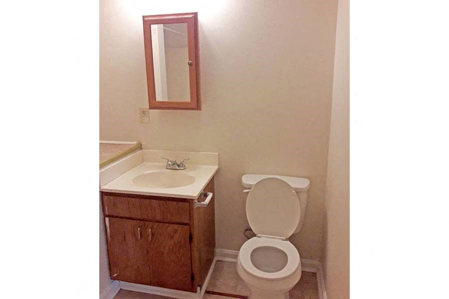 a bathroom with a toilet and a sink