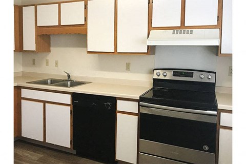 a kitchen with a stove and a sink