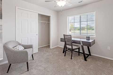 a dining room with a table and chairs
