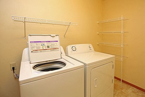a bathroom with a washing machine and a dryer