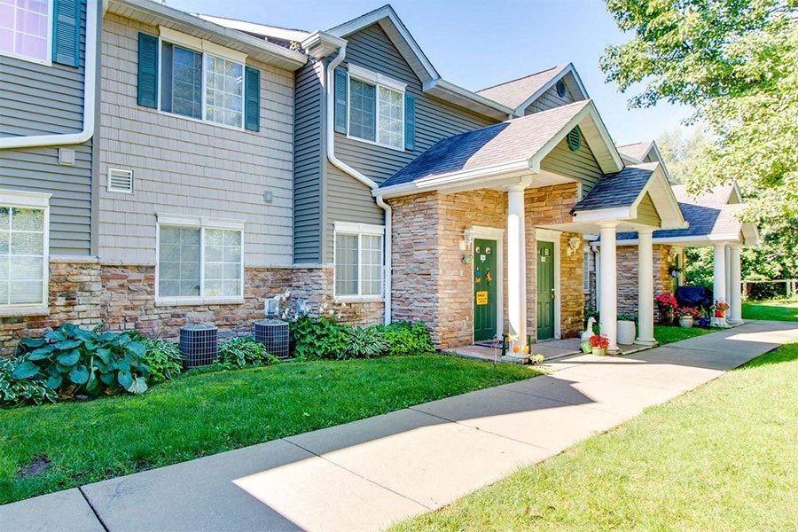 a house with a sidewalk in front of it