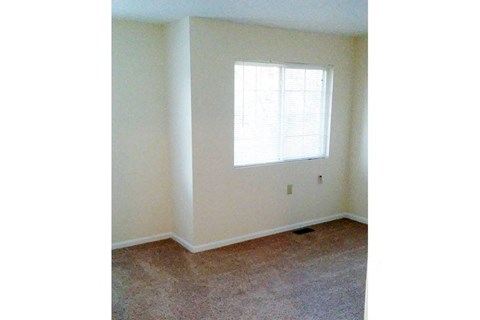 an empty room with a window in it