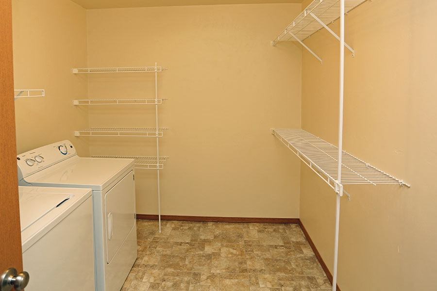 a laundry room with a washer and dryer in it
