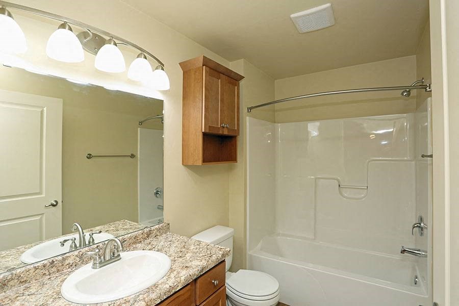 a bathroom with a sink toilet and a shower