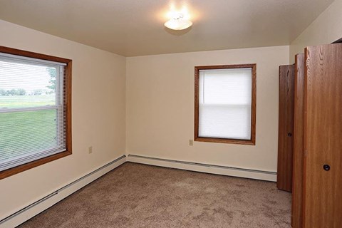 A room with a window and a door.