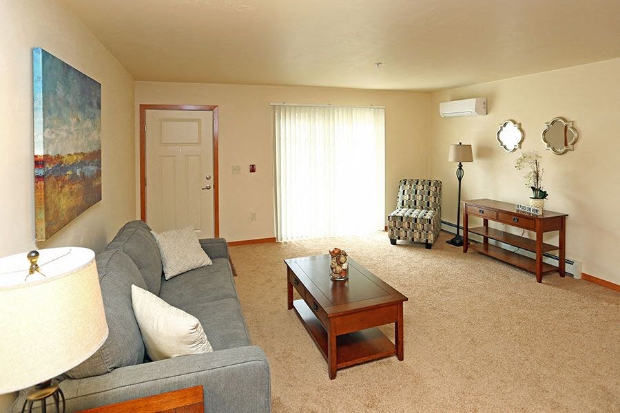 a living room with a couch and a table