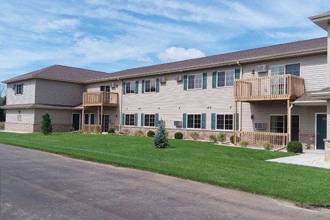 a large house with a yard in front of it