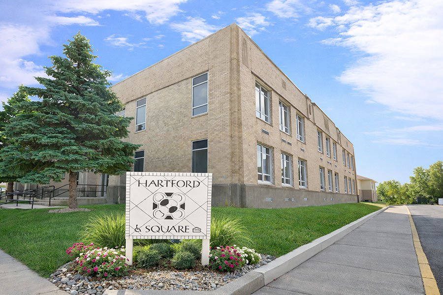 A building with a sign that says Hartford Square.