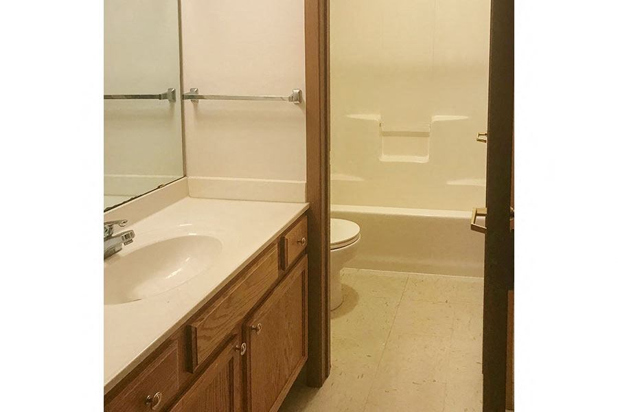 a bathroom with a sink toilet and a shower