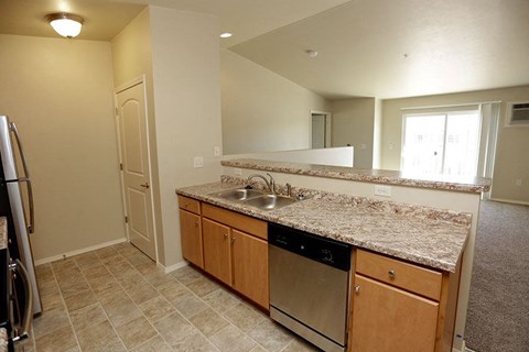 a kitchen with a granite counter top and a sink
