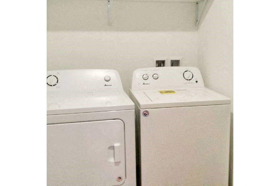a white washer and dryer are next to each other