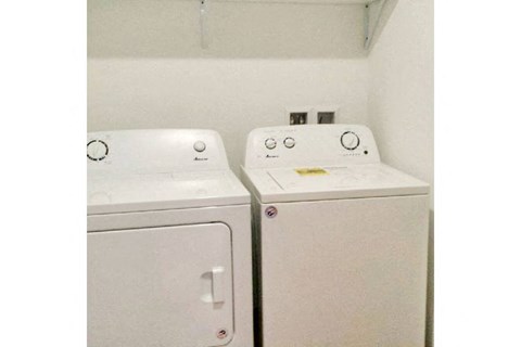 a white washer and dryer are next to each other