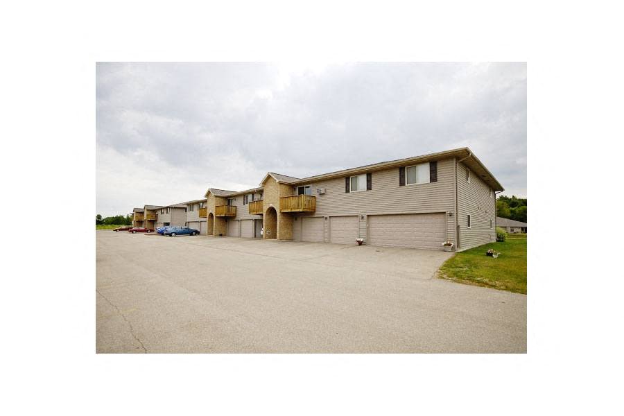 a building with a parking lot in front of it