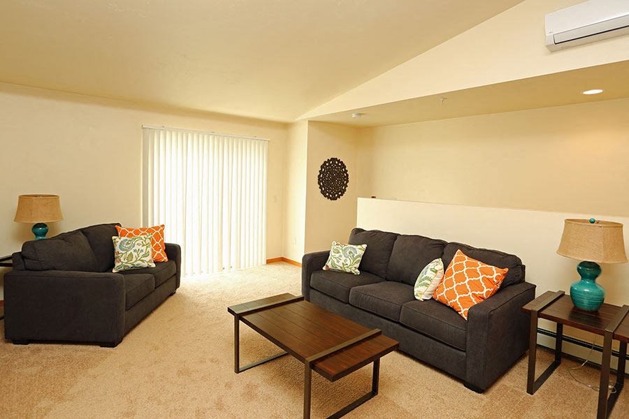 a living room with a couch and a table