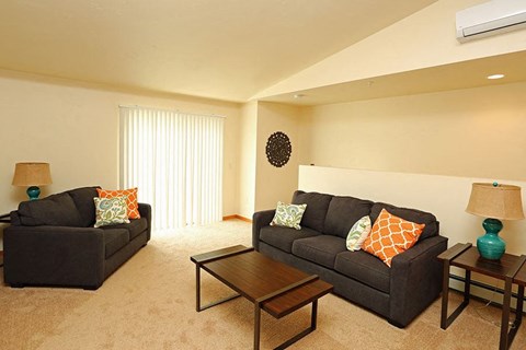 a living room with a couch and a table