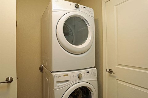 a washing machine and a dryer in a laundry room