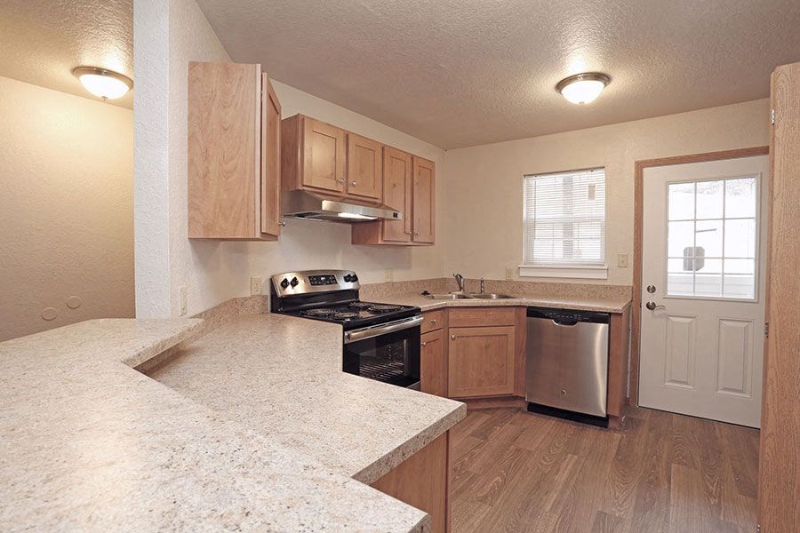 a kitchen with a stove and a sink
