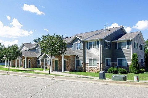 a row of houses on the side of a street