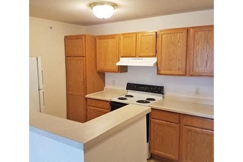 a kitchen with a stove and a refrigerator